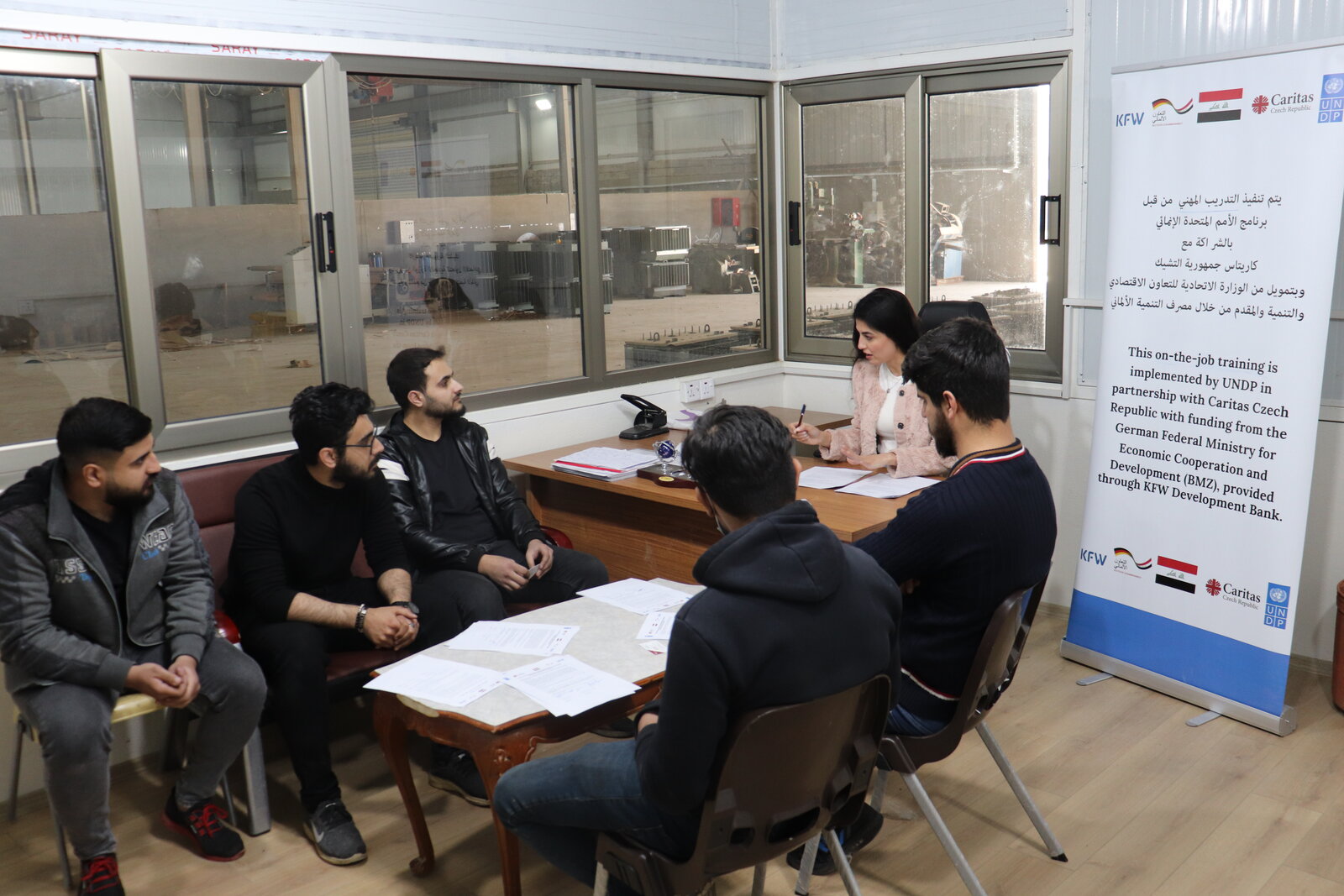 Five electrical engineers who were hired by the same company after participating in on-the-job training Five electrical engineers who were hired by the same company after participating in on-the-job training